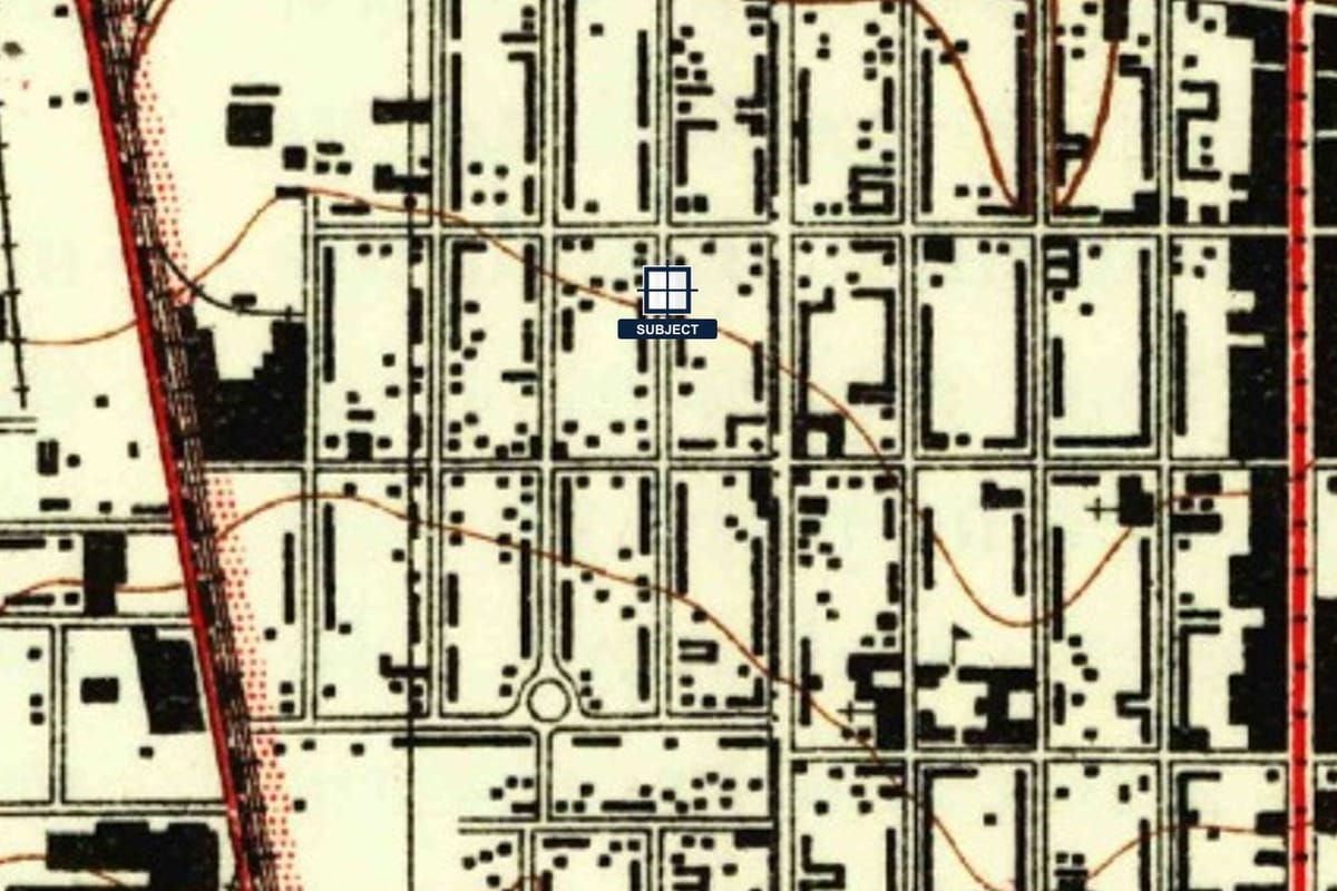 Later historical topographic sheet showing building footprints around the property